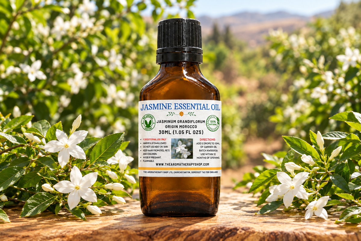 Moroccan Jasmine showcase with your label, a centred slightly set-back bottle and full-sized jasmine flowers on natural olive wood